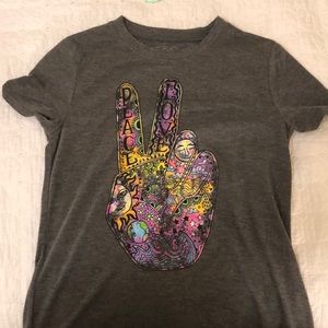 gray shirt with a peace sign